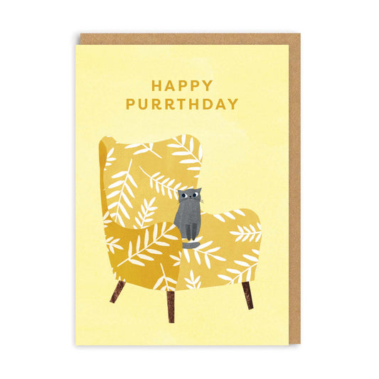 Birthday card with a cat on an armchair and text that reads Happy Purrthday