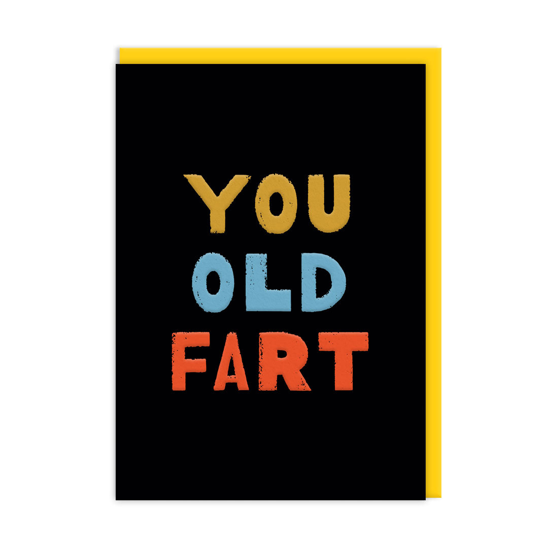Black Birthday card with multi coloured text that reads "You Old Fart" and accompanying yellow envelope