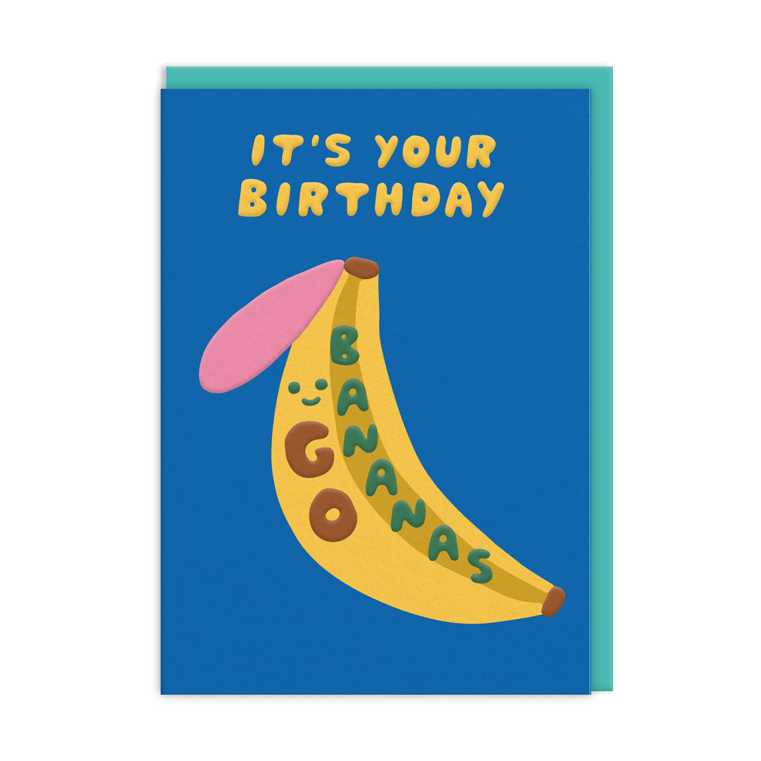 Solid blue background, with a groovy banana illustration including a smiley face, Text reads "It's your birthday go bananas"